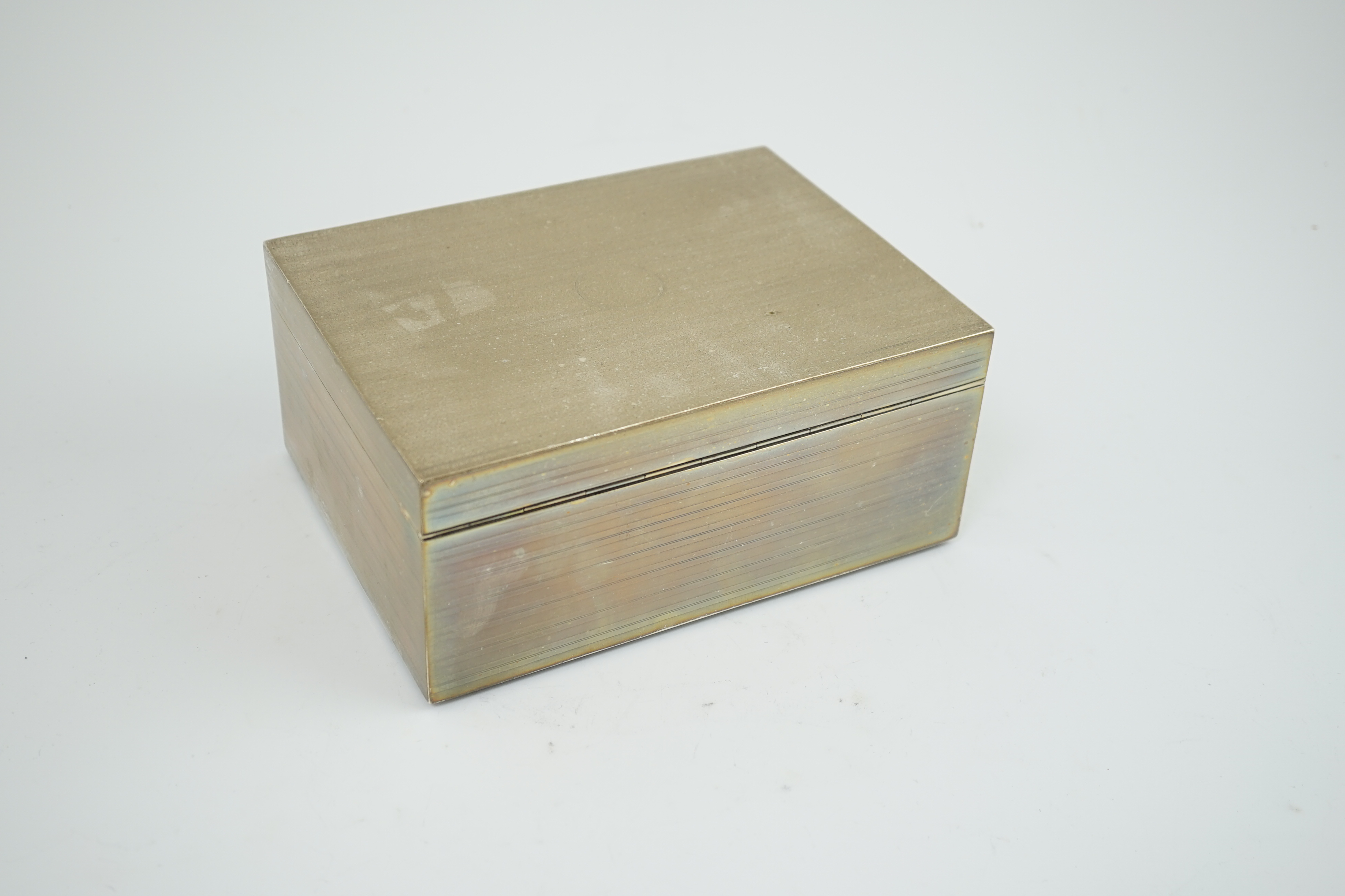 A large George V engine turned silver mounted cigar/cigarette box, by Goldsmiths & Silversmiths Co Ltd